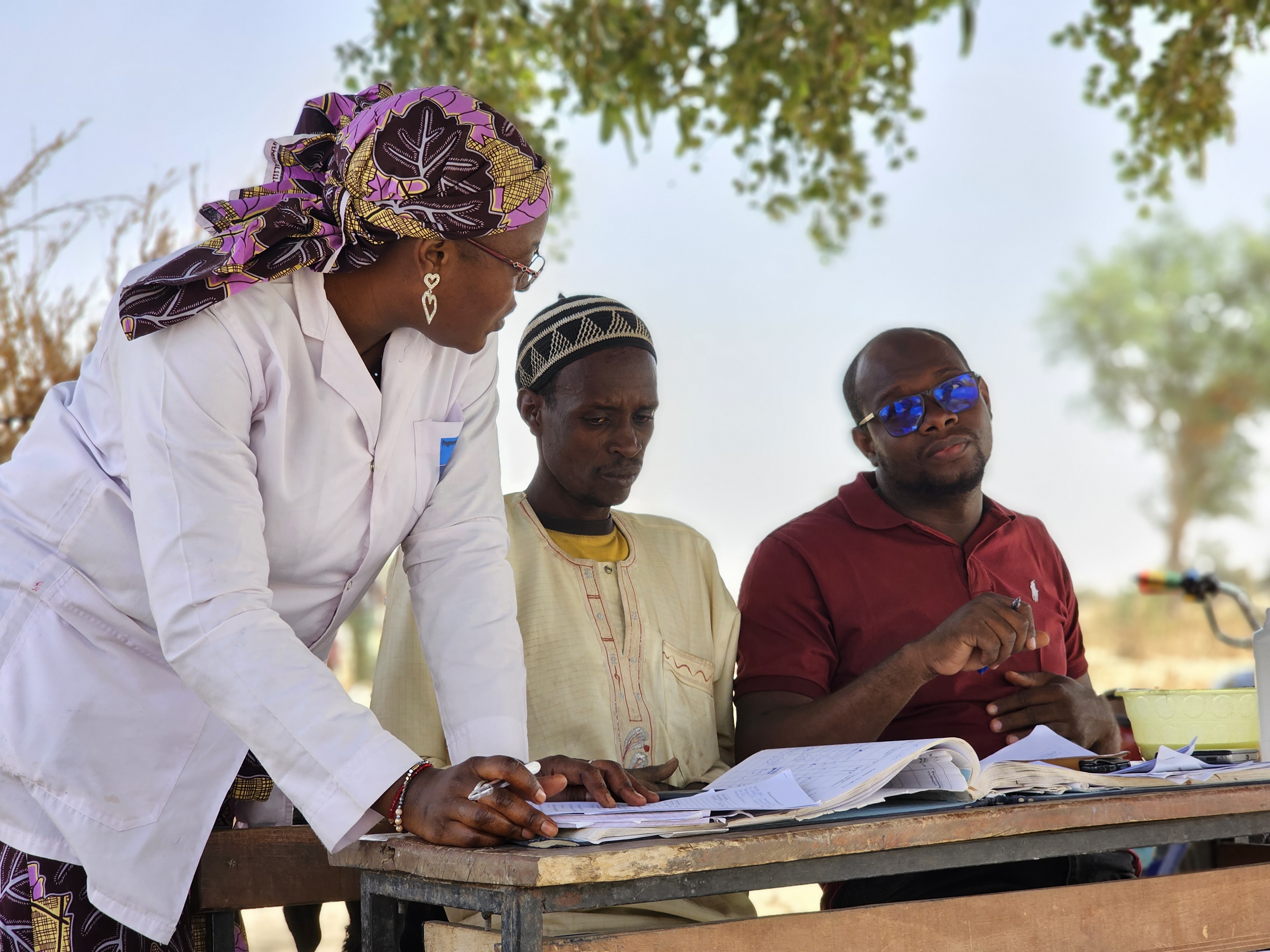 Nurse Rachida supervises Kiro Maman, (right) a community health worker in Loma Peulh, Niger.  